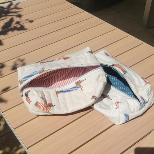 Two patterned bags on a wooden table outdoors