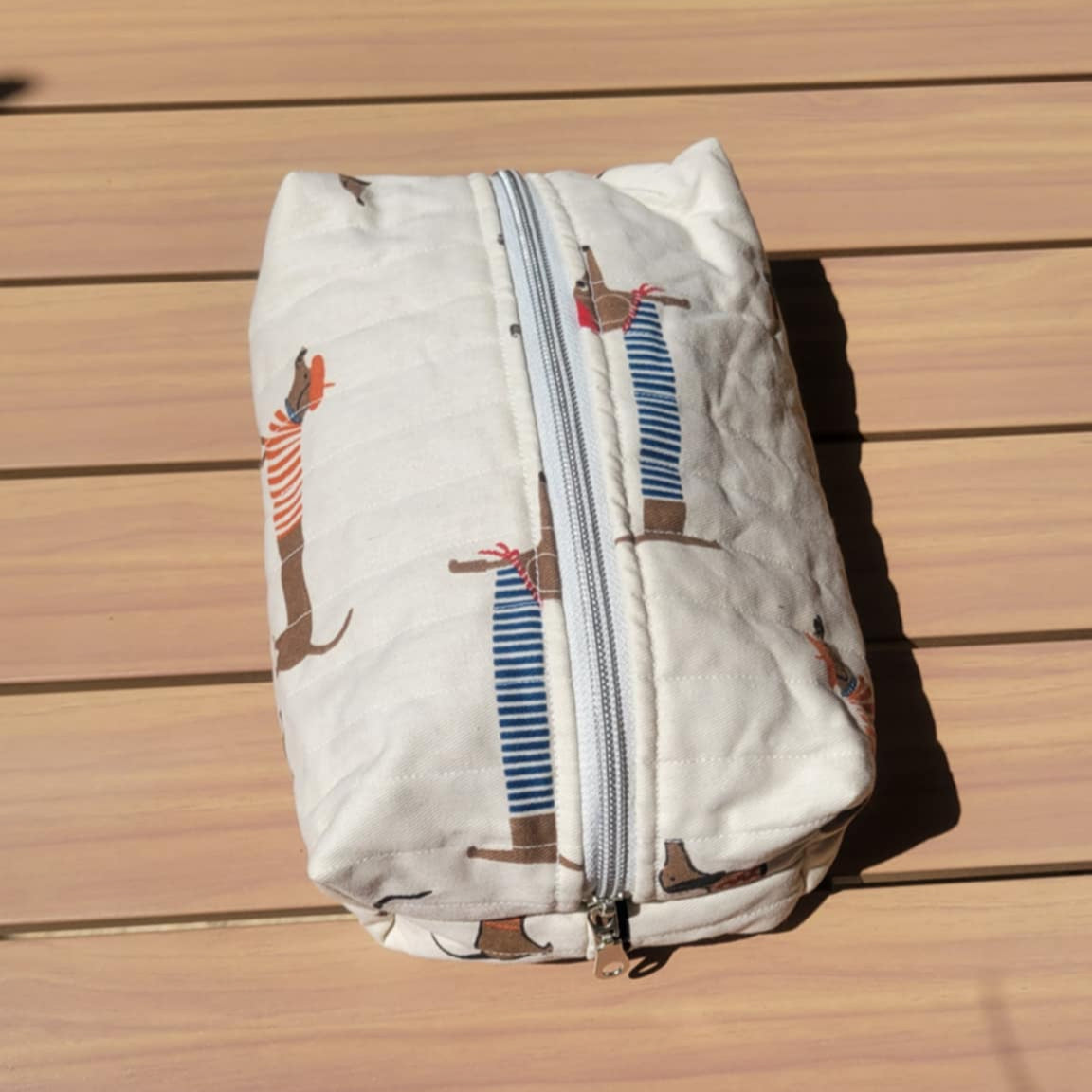 Folded fabric with a zipper on a wooden surface