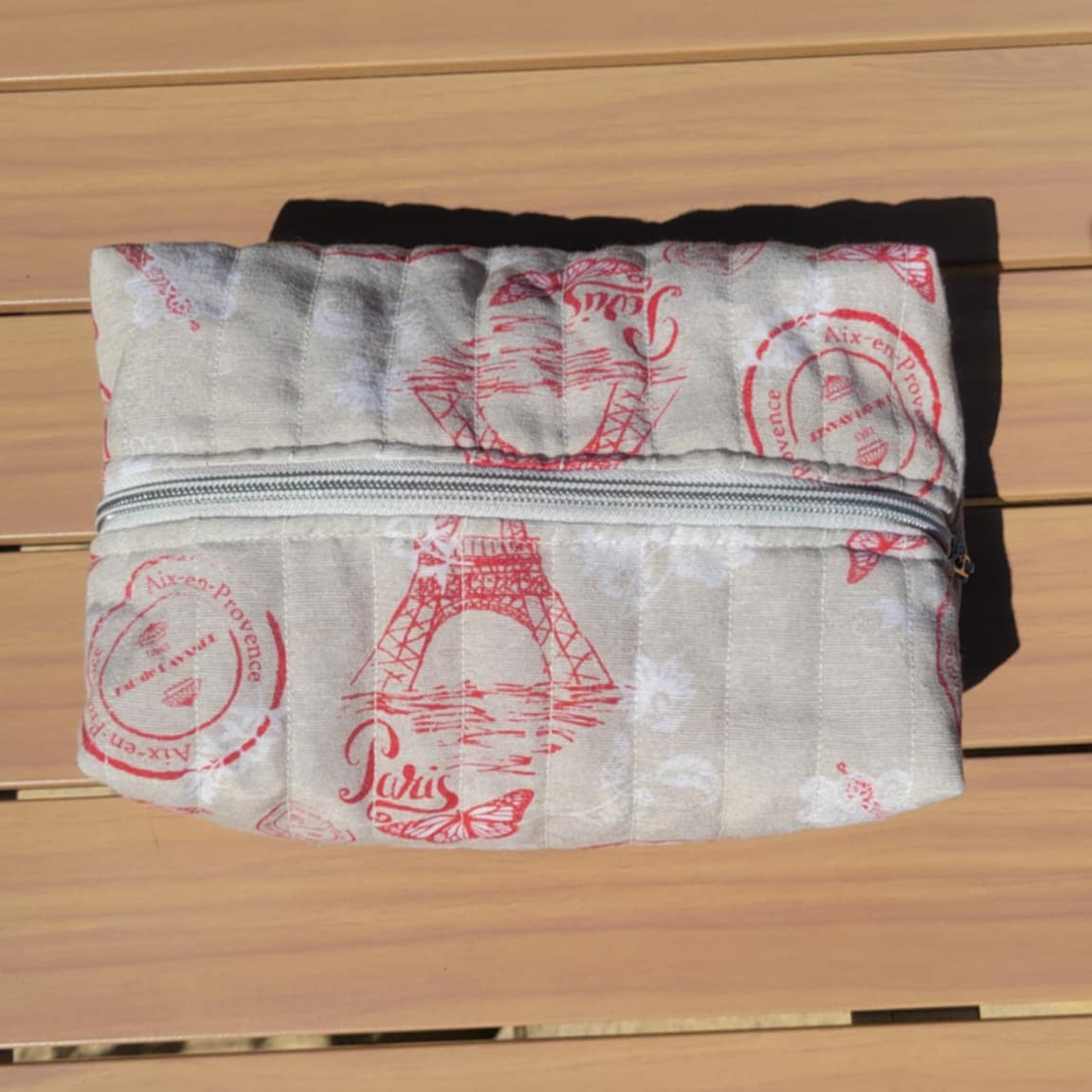Packaged product with red text on a wooden surface
